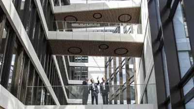  Nove Building with three people talking